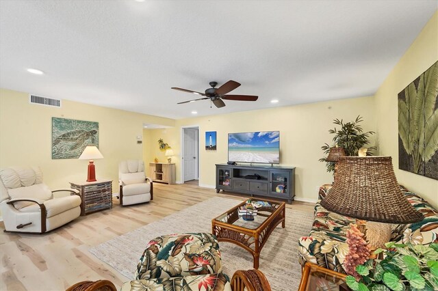 819 Montrose Dr Unit 102, Venice, FL 34293 - living area featuring ceiling fan, recessed lighting, baseboards, wood finished floors, and visible vents