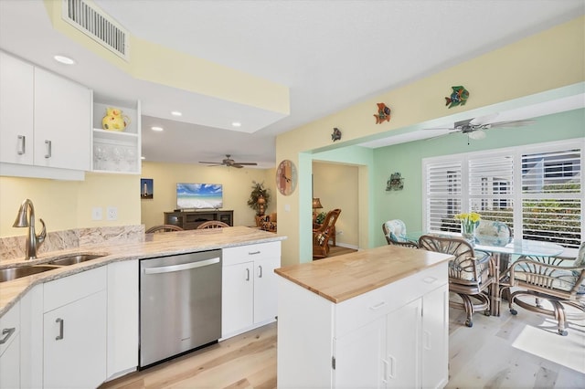 819 Montrose Dr Unit 102, Venice, FL 34293 - kitchen with a sink, ceiling fan, stainless steel dishwasher, and visible vents