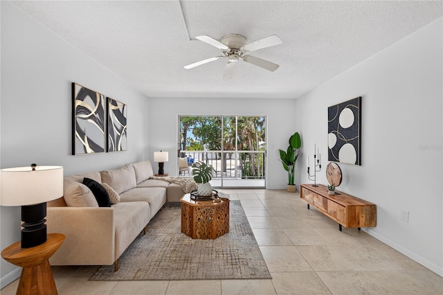 5031 N Beach Rd Unit 118, Englewood, FL 34223 - living area with a ceiling fan, a textured ceiling, and light tile patterned floors