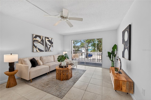 5031 N Beach Rd Unit 118, Englewood, FL 34223 - living room with a textured ceiling, a ceiling fan, and light tile patterned floors