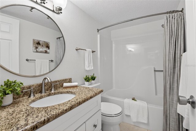 5031 N Beach Rd Unit 118, Englewood, FL 34223 - full bathroom with shower / bathtub combination with curtain, vanity, and a textured ceiling