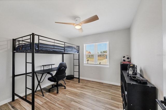 bedroom featuring baseboards and light wood-type flooring