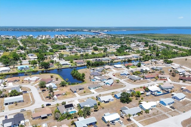 bird's eye view featuring a residential view and a water view