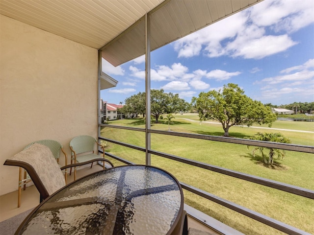 sunroom / solarium with view of golf course