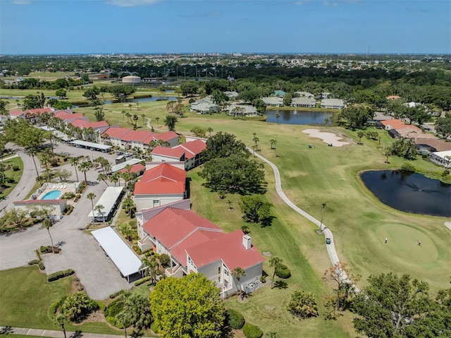 birds eye view of property with a water view, golf course view, and a residential view