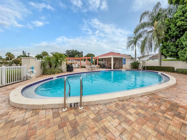 pool featuring a patio and fence private yard