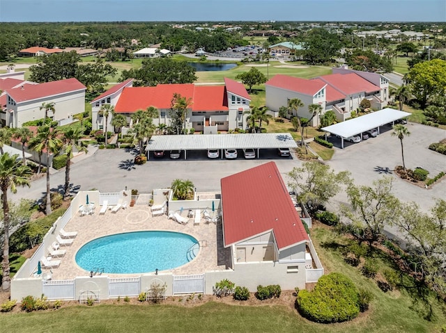 bird's eye view featuring view of golf course and a water view