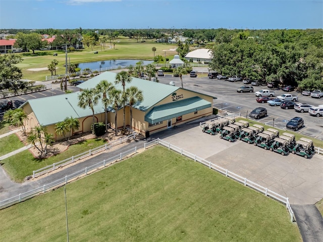 bird's eye view featuring a water view and golf course view