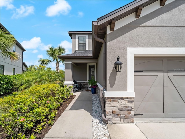 8304 Shooting Star Rd, Sarasota, FL 34241 - property entrance with stone siding and stucco siding