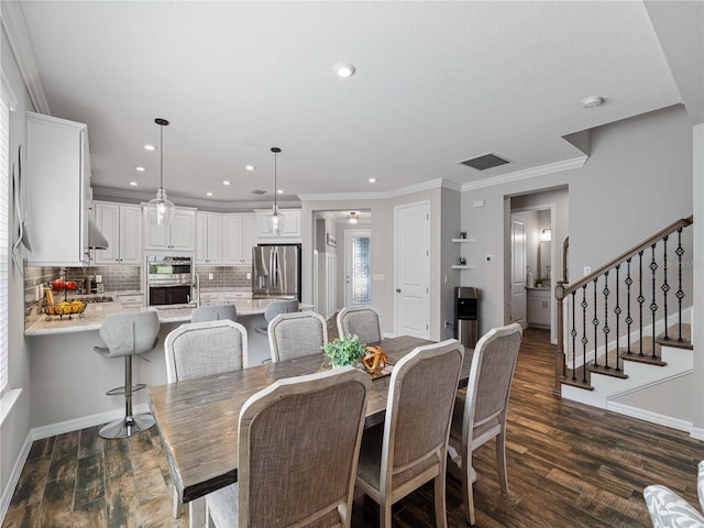 8304 Shooting Star Rd, Sarasota, FL 34241 - dining room with baseboards, recessed lighting, crown molding, stairway, and dark wood finished floors