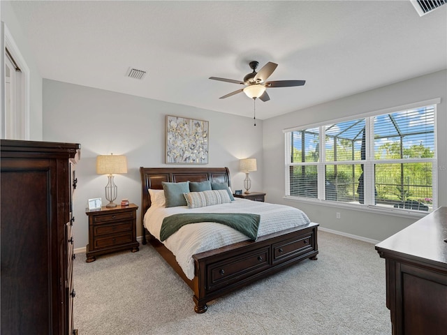 8304 Shooting Star Rd, Sarasota, FL 34241 - bedroom featuring light carpet, baseboards, and ceiling fan