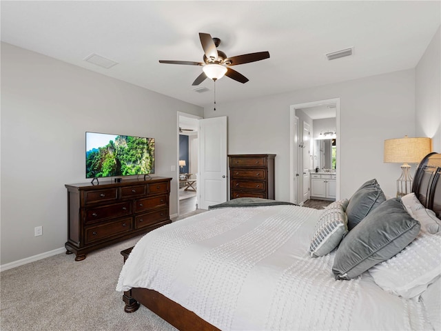8304 Shooting Star Rd, Sarasota, FL 34241 - bedroom with baseboards, light carpet, a ceiling fan, and connected bathroom