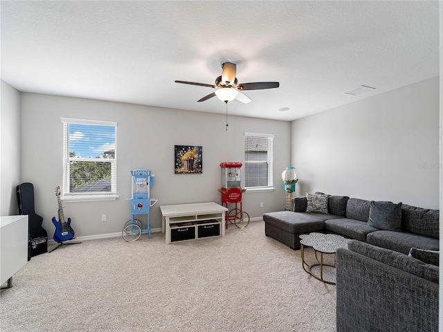 8304 Shooting Star Rd, Sarasota, FL 34241 - carpeted living room with ceiling fan, plenty of natural light, and baseboards