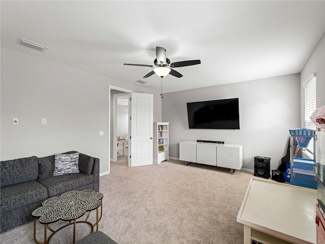 8304 Shooting Star Rd, Sarasota, FL 34241 - living area with ceiling fan, light carpet, and baseboards