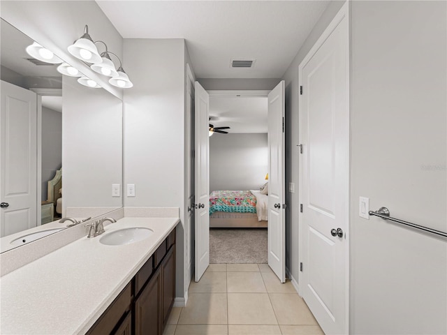 8304 Shooting Star Rd, Sarasota, FL 34241 - bathroom featuring tile patterned flooring, ensuite bath, vanity, and ceiling fan