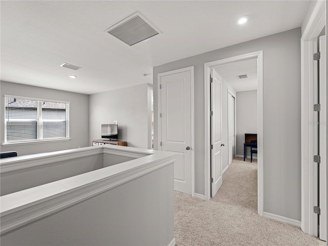 8304 Shooting Star Rd, Sarasota, FL 34241 - corridor with light colored carpet, recessed lighting, and baseboards