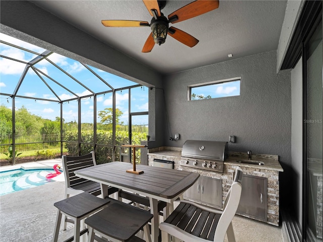8304 Shooting Star Rd, Sarasota, FL 34241 - view of patio / terrace with area for grilling, a grill, a sink, glass enclosure, and a ceiling fan