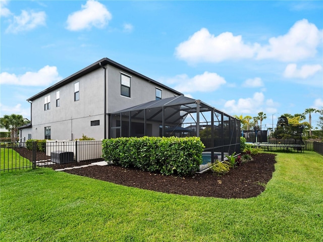 8304 Shooting Star Rd, Sarasota, FL 34241 - back of property featuring stucco siding, glass enclosure, and central AC