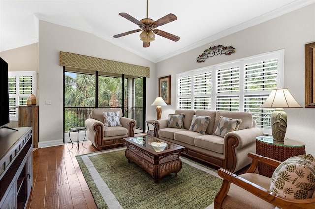living room featuring crown molding, dark wood-style flooring, ceiling fan, baseboards, and lofted ceiling
