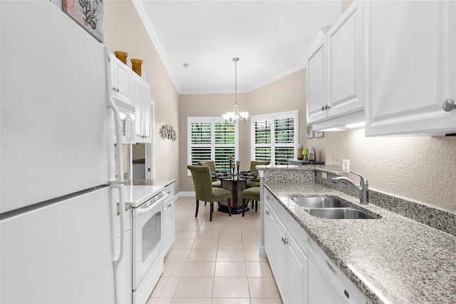 kitchen with crown molding, white cabinets, a sink, white appliances, and a chandelier