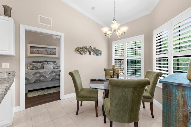 dining area with visible vents, crown molding, light tile patterned floors, baseboards, and a chandelier