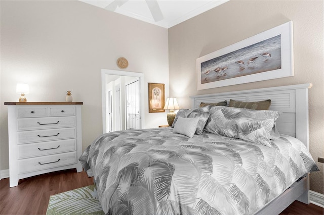 bedroom featuring ornamental molding and dark wood-type flooring