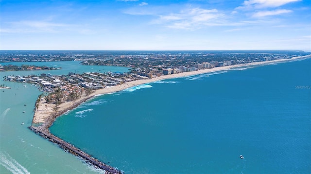 drone / aerial view with a water view and a beach view