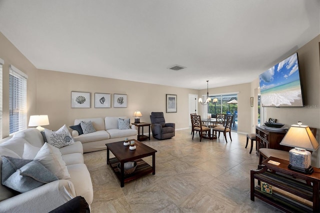 316 Signorelli Dr, Nokomis, FL 34275 - living area featuring baseboards, visible vents, and a chandelier