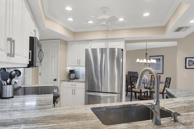 316 Signorelli Dr, Nokomis, FL 34275 - kitchen featuring visible vents, ceiling fan with notable chandelier, recessed lighting, a sink, and appliances with stainless steel finishes