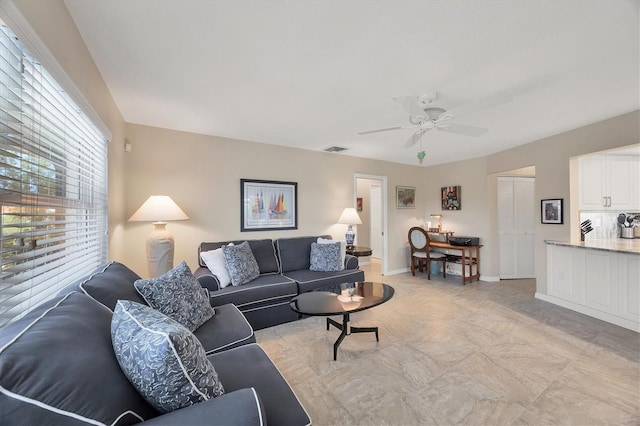 316 Signorelli Dr, Nokomis, FL 34275 - living room featuring visible vents, baseboards, and ceiling fan
