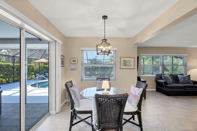 316 Signorelli Dr, Nokomis, FL 34275 - dining area with baseboards and an inviting chandelier