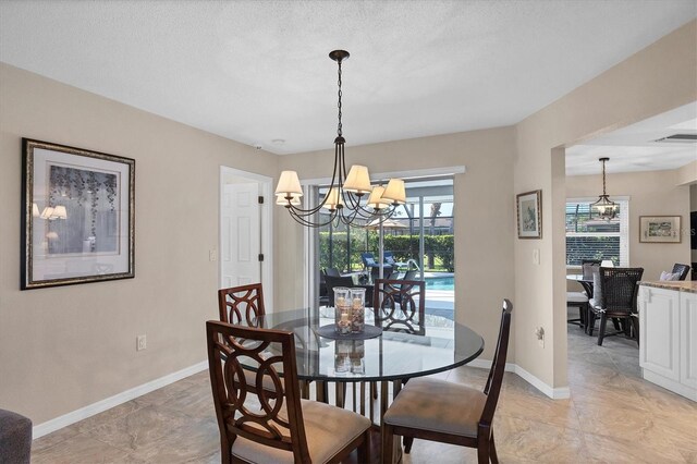 316 Signorelli Dr, Nokomis, FL 34275 - dining room with baseboards, a notable chandelier, and visible vents