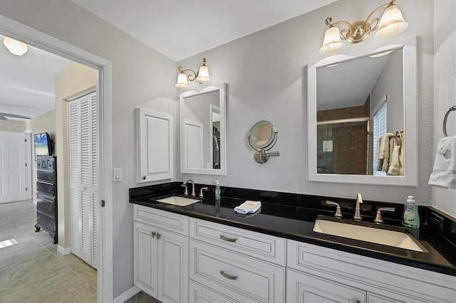 316 Signorelli Dr, Nokomis, FL 34275 - bathroom featuring a sink, a shower stall, a closet, and double vanity