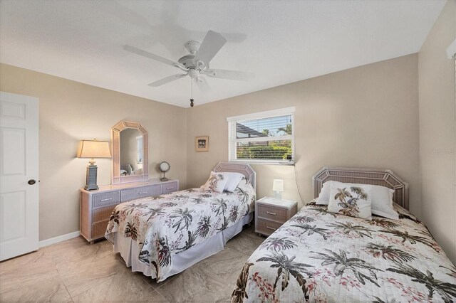 316 Signorelli Dr, Nokomis, FL 34275 - bedroom featuring baseboards, ceiling fan, and marble finish floor
