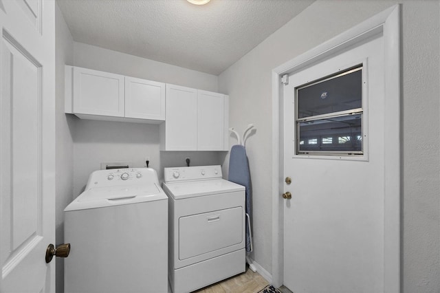 316 Signorelli Dr, Nokomis, FL 34275 - washroom with baseboards, a textured ceiling, cabinet space, and washer and dryer
