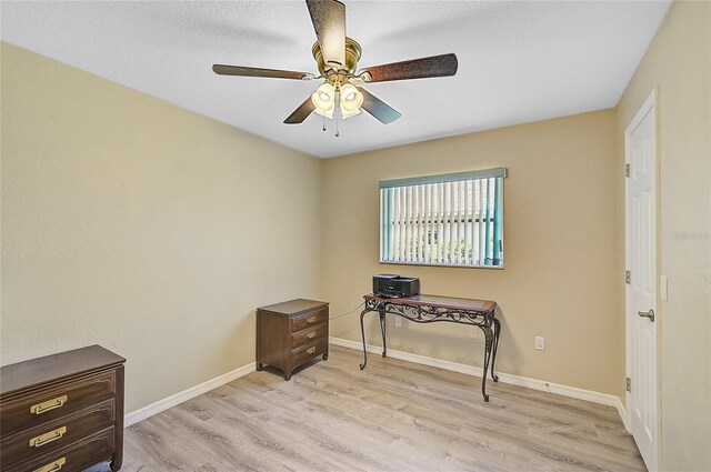 447 Rotonda Cir, Rotonda West, FL 33947 - office with light wood-style floors, a ceiling fan, and baseboards