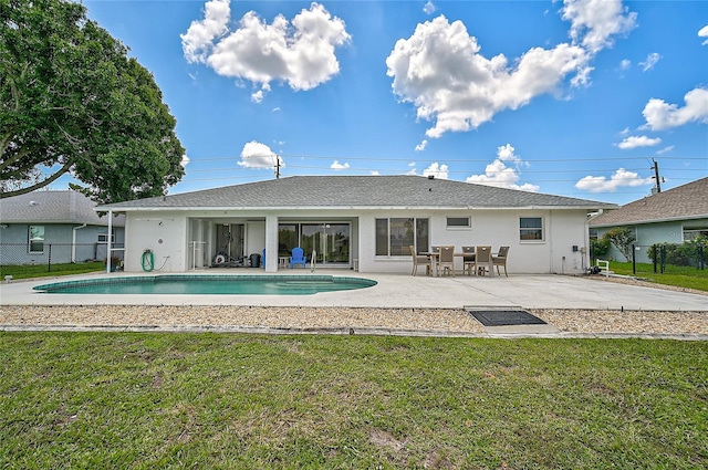 447 Rotonda Cir, Rotonda West, FL 33947 - rear view of house featuring stucco siding and a patio