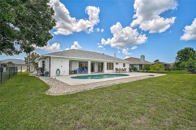 447 Rotonda Cir, Rotonda West, FL 33947 - back of property with a patio area and stucco siding