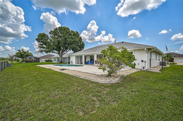 447 Rotonda Cir, Rotonda West, FL 33947 - back of property with a patio area and stucco siding