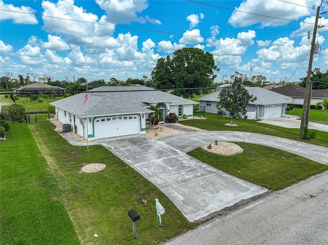 447 Rotonda Cir, Rotonda West, FL 33947 - single story home featuring driveway, a front lawn, central air condition unit, roof with shingles, and a residential view