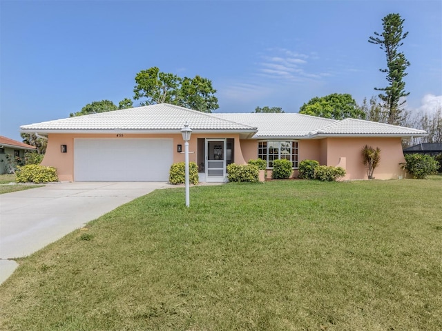455 Rubens Dr E, Nokomis, FL 34275 - single story home with a tiled roof, a garage, concrete driveway, and a front yard