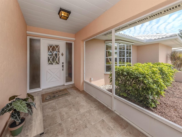 455 Rubens Dr E, Nokomis, FL 34275 - doorway to property with stucco siding