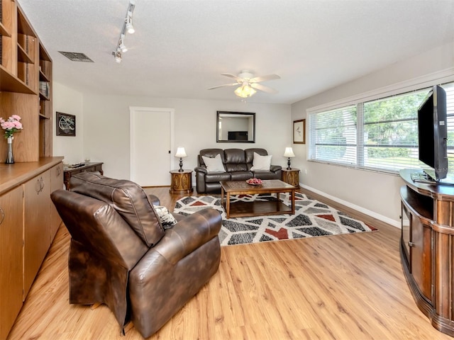 455 Rubens Dr E, Nokomis, FL 34275 - living room with ceiling fan, baseboards, track lighting, and light wood finished floors