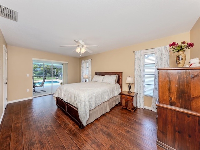 455 Rubens Dr E, Nokomis, FL 34275 - bedroom with access to exterior, dark wood finished floors, and baseboards