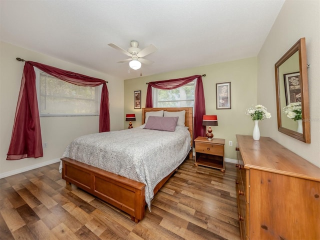 455 Rubens Dr E, Nokomis, FL 34275 - bedroom with wood finished floors, baseboards, and a ceiling fan