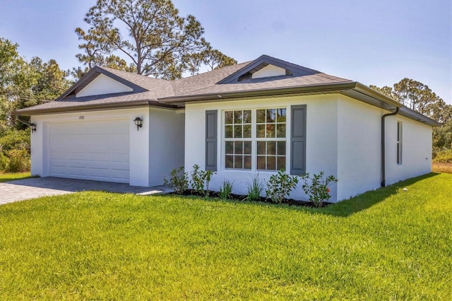 2032 Jagust Rd, North Port, FL 34288 - ranch-style house featuring roof with shingles, an attached garage, a front lawn, stucco siding, and driveway