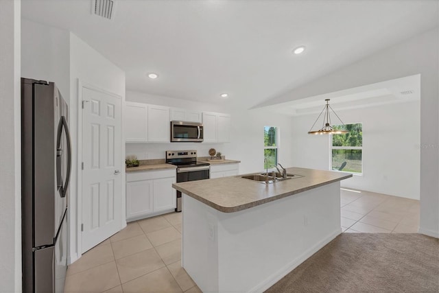 2032 Jagust Rd, North Port, FL 34288 - kitchen with visible vents, appliances with stainless steel finishes, a sink, light tile patterned floors, and white cabinets