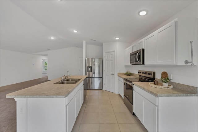 2032 Jagust Rd, North Port, FL 34288 - kitchen with a sink, light countertops, lofted ceiling, stainless steel appliances, and white cabinetry
