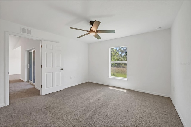 2032 Jagust Rd, North Port, FL 34288 - carpeted spare room with baseboards, a ceiling fan, and visible vents