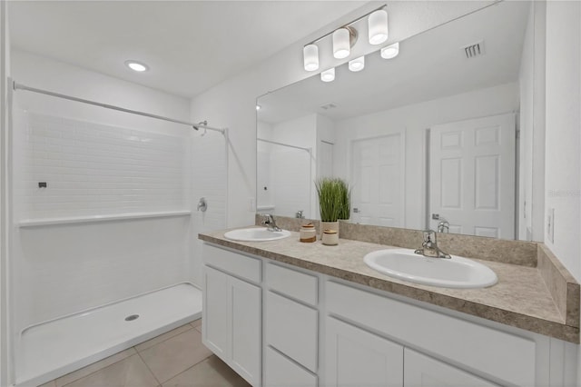 2032 Jagust Rd, North Port, FL 34288 - bathroom with a sink, tile patterned flooring, and walk in shower